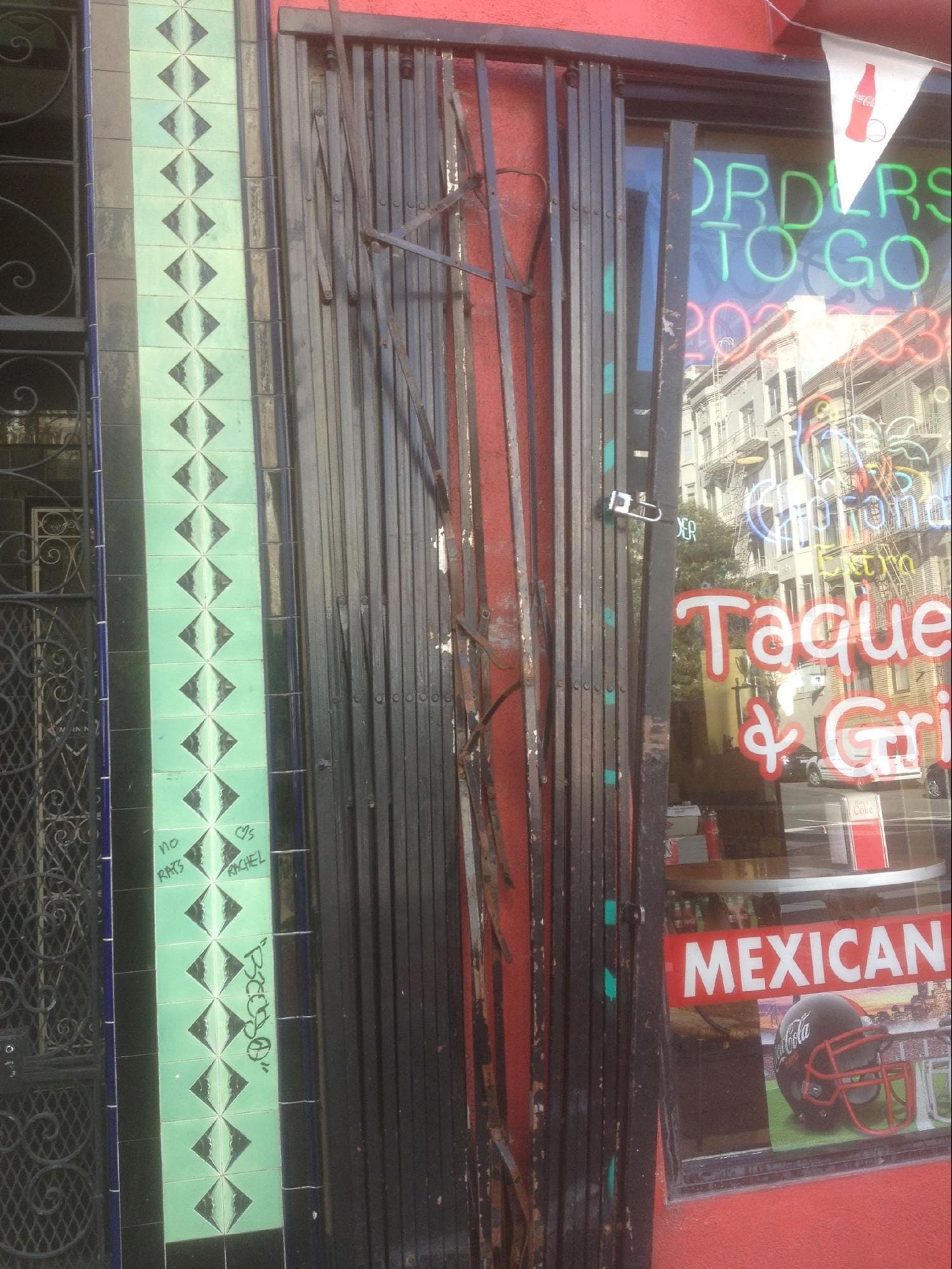 A broken gate in front of a business.